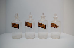 A Set of 19th Century Hand Blown Apothecary Bottles