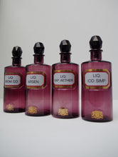 Load image into Gallery viewer, Set of Four Early 20th Century Apothecary Bottles (Purple Glass)
