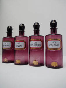 Set of Four Early 20th Century Apothecary Bottles (Purple Glass)