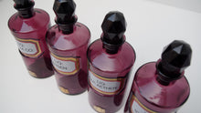 Load image into Gallery viewer, Set of Four Early 20th Century Apothecary Bottles (Purple Glass)
